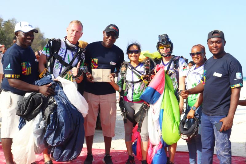Diani Regata skydivers hand over the prize that soared the sky